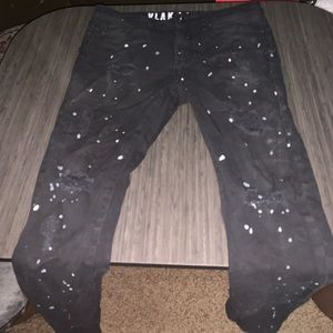Black jeans with white spots